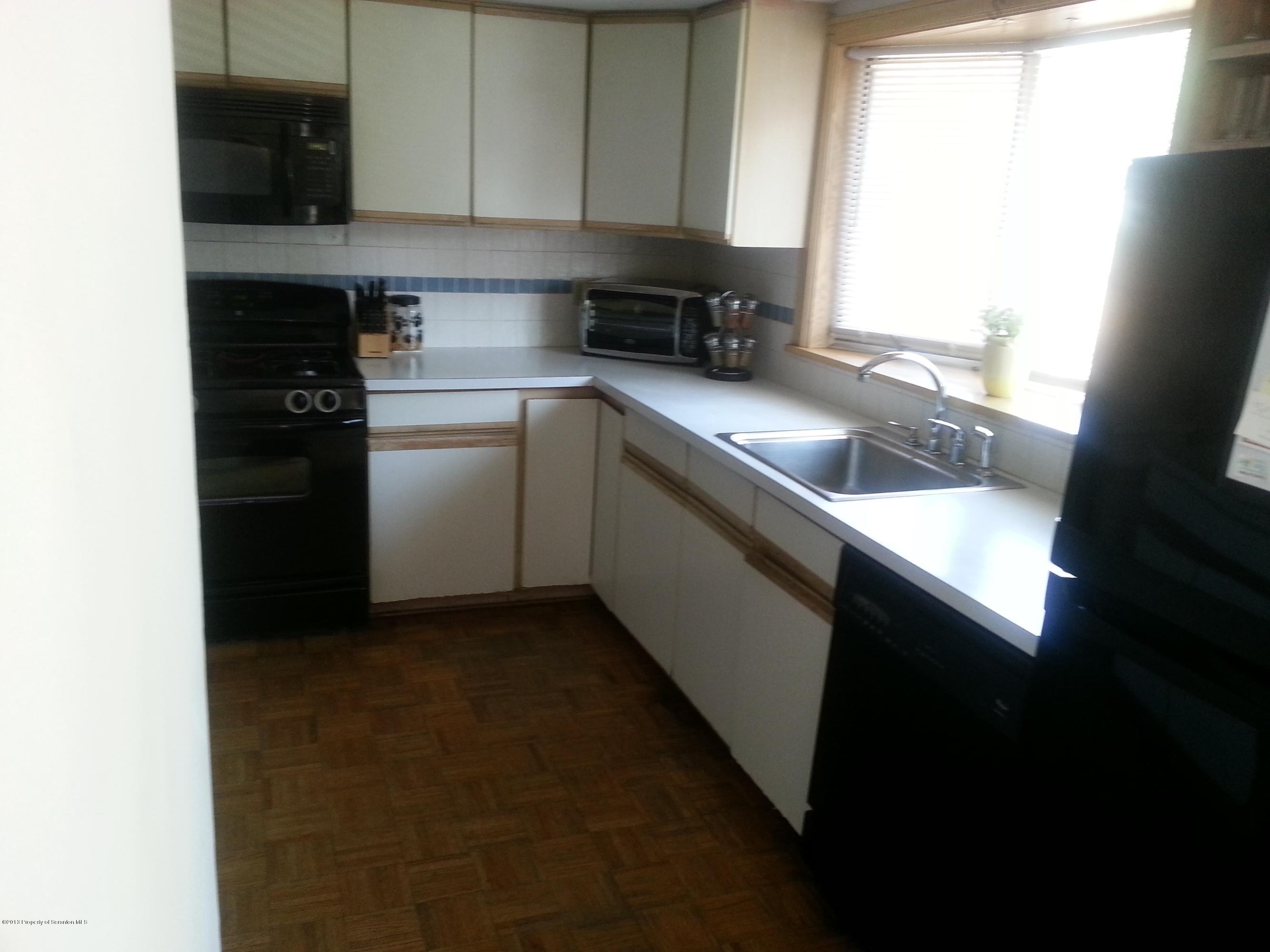 621 Electric Street Scranton, PA 18509 - Photo 15 of 29 a kitchen with a sink cabinets and a window