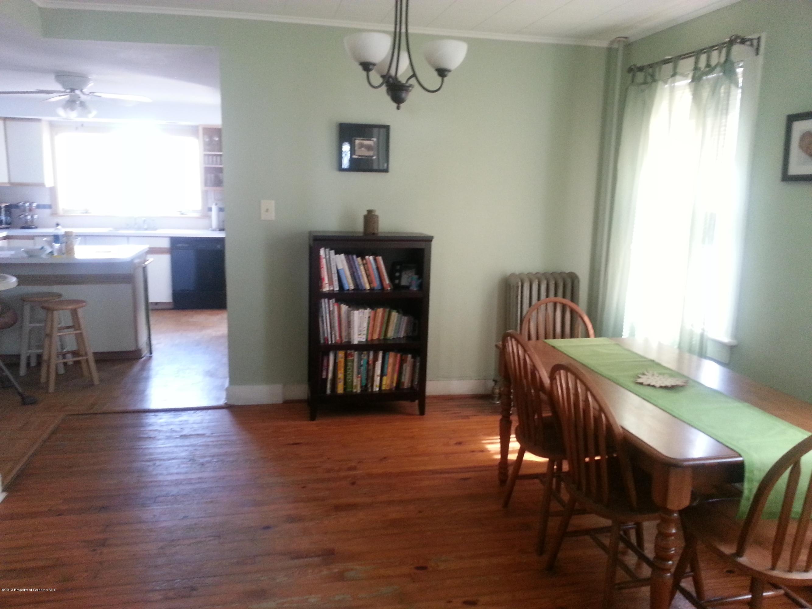 621 Electric Street Scranton, PA 18509 - Photo 16 of 29 a view of a dining room with furniture and wooden floor