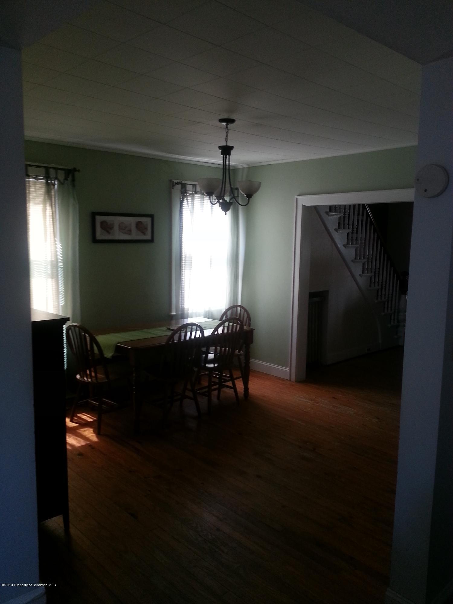 621 Electric Street Scranton, PA 18509 - Photo 17 of 29 a living room with furniture and a chandelier