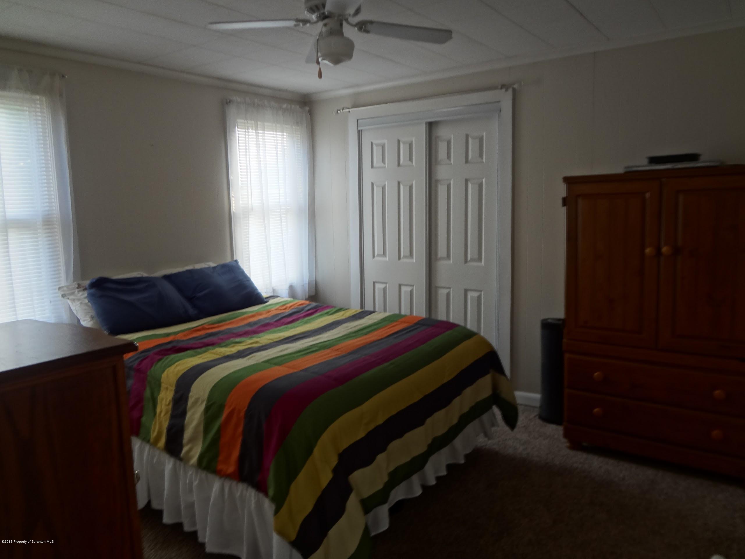 621 Electric Street Scranton, PA 18509 - Photo 18 of 29 a bedroom with a bed and a closet