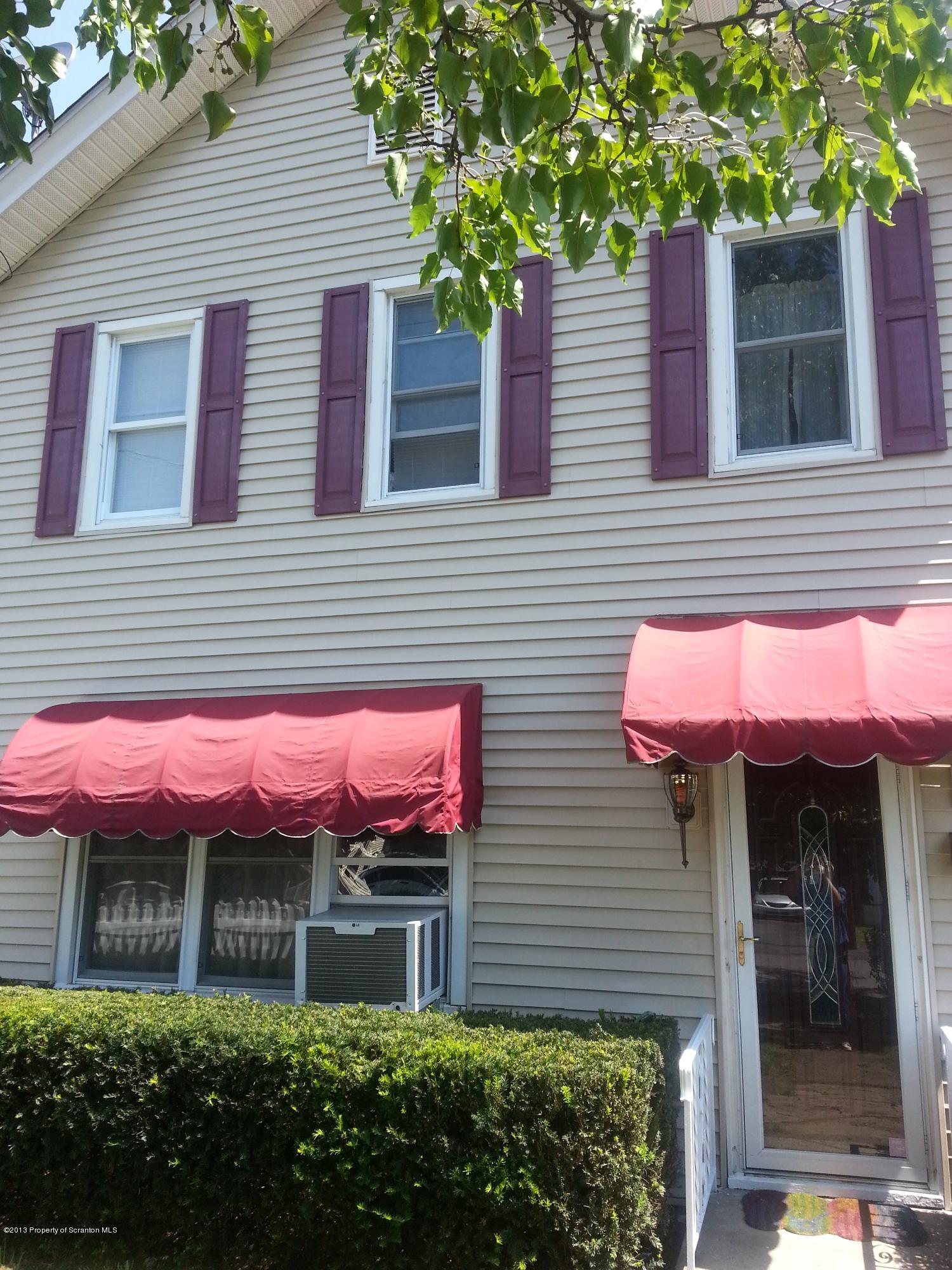 621 Electric Street Scranton, PA 18509 - Photo 2 of 29 a front view of a house with a yard