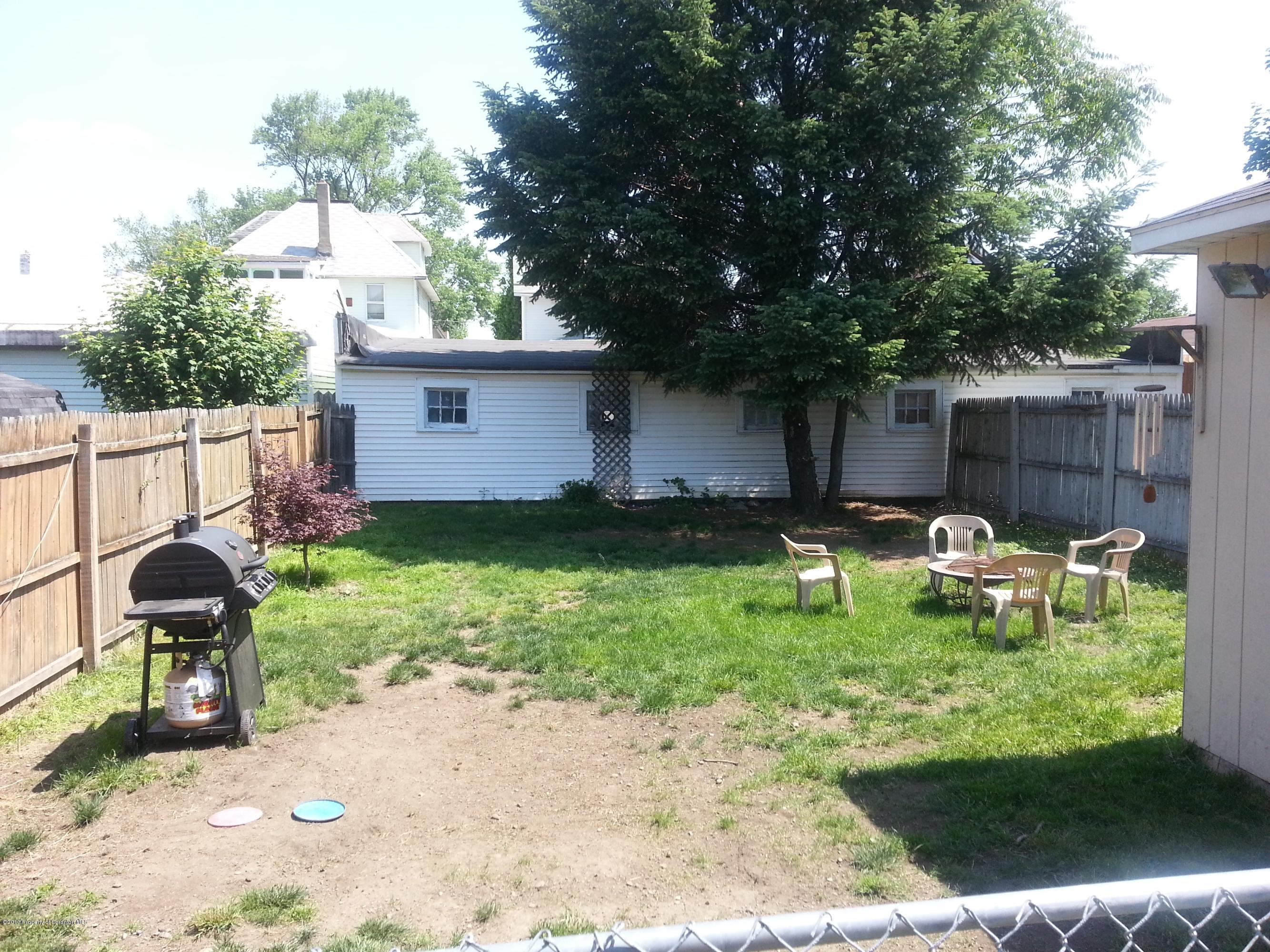 621 Electric Street Scranton, PA 18509 - Photo 8 of 29 a backyard of a house with table and chairs