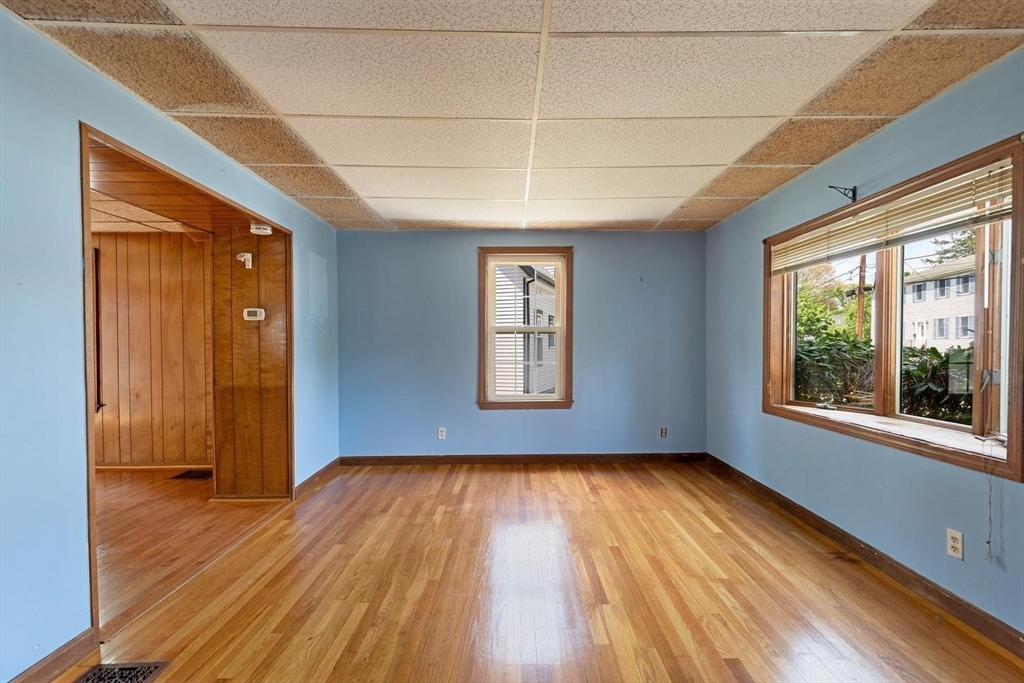 19 Butler Avenue Wakefield, MA 01880 - Photo 5 of 33 a view of empty room with wooden floor and fan