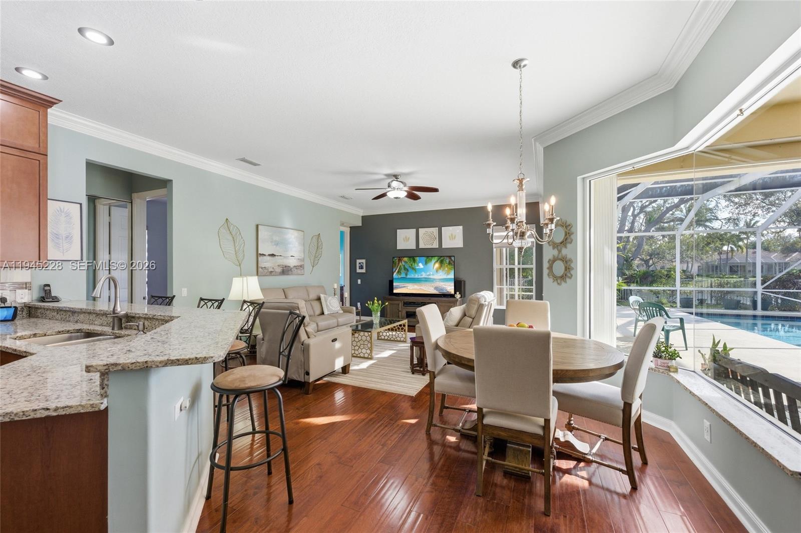 7646 Red River Road West Palm Beach, FL 33411 - Photo 14 of 69 a view of a dining room with furniture window and wooden floor