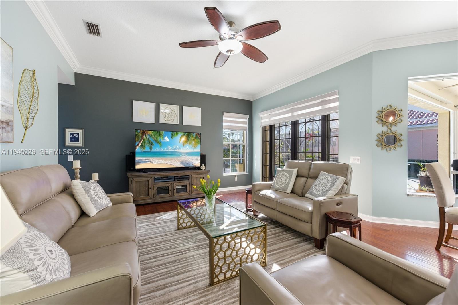 7646 Red River Road West Palm Beach, FL 33411 - Photo 24 of 69 a living room with furniture and a flat screen tv