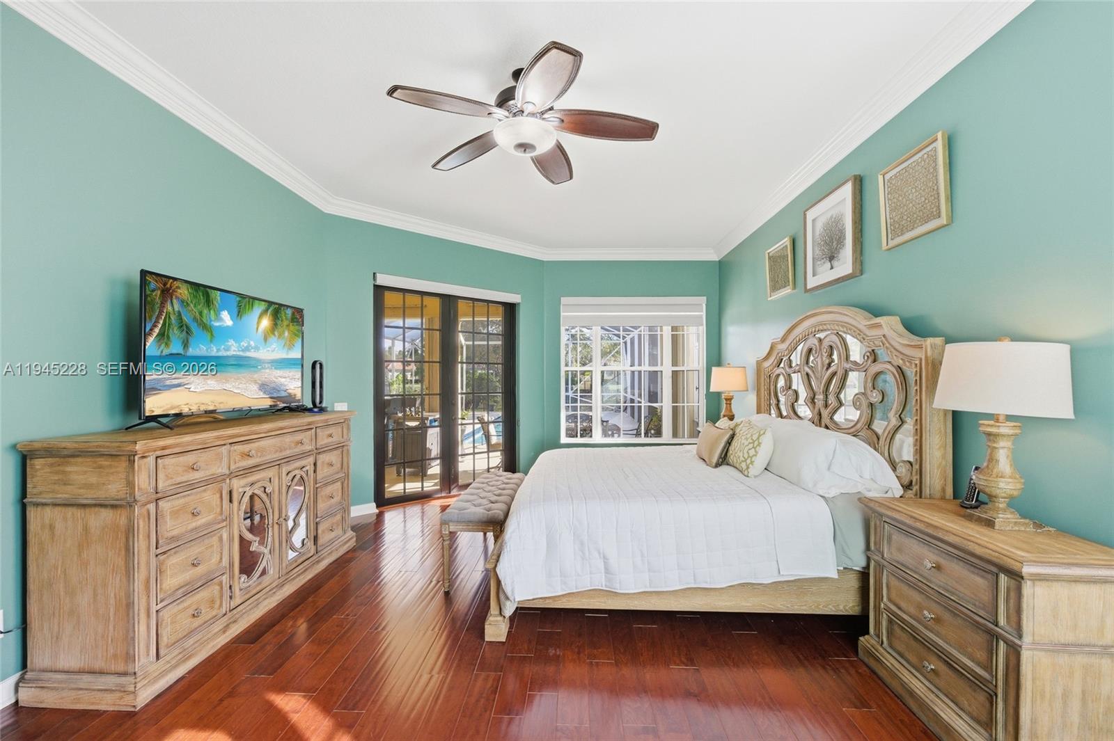 7646 Red River Road West Palm Beach, FL 33411 - Photo 28 of 69 a bedroom with a bed and a flat screen tv