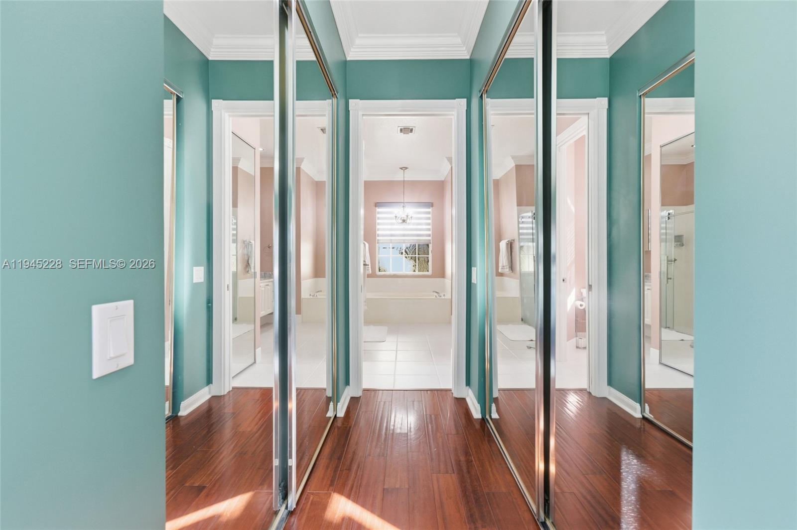 7646 Red River Road West Palm Beach, FL 33411 - Photo 30 of 69 a view of a hallway with wooden floor and glass door
