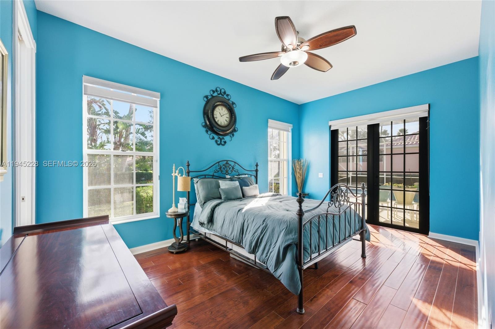 7646 Red River Road West Palm Beach, FL 33411 - Photo 35 of 69 a living room with a bed furniture and a large window