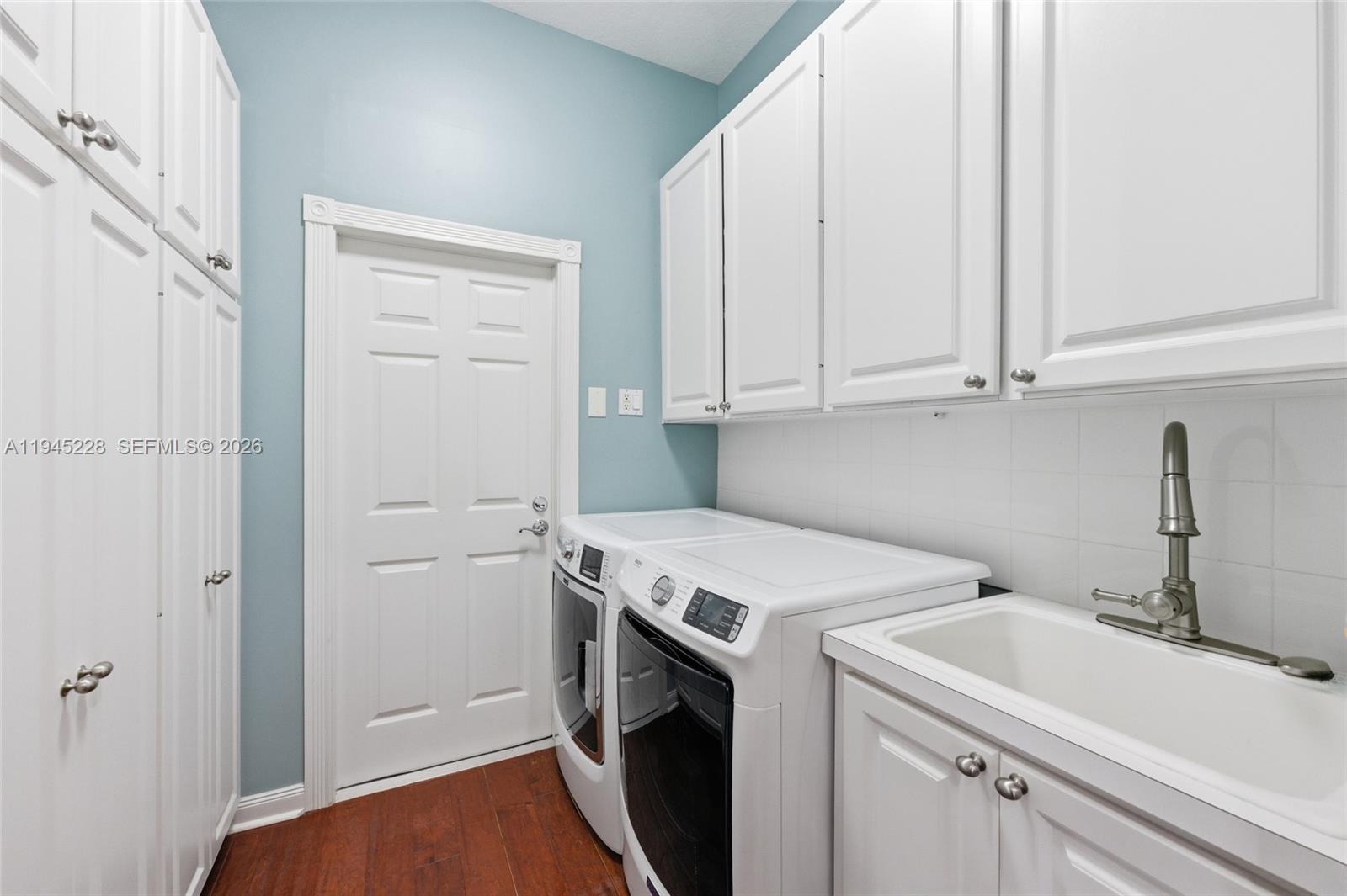 7646 Red River Road West Palm Beach, FL 33411 - Photo 42 of 69 a utility room with dryer and washer