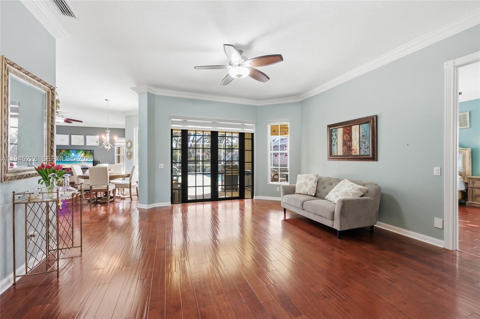 7646 Red River Road West Palm Beach, FL 33411 - Photo 7 of 69 a living room with furniture and wooden floor