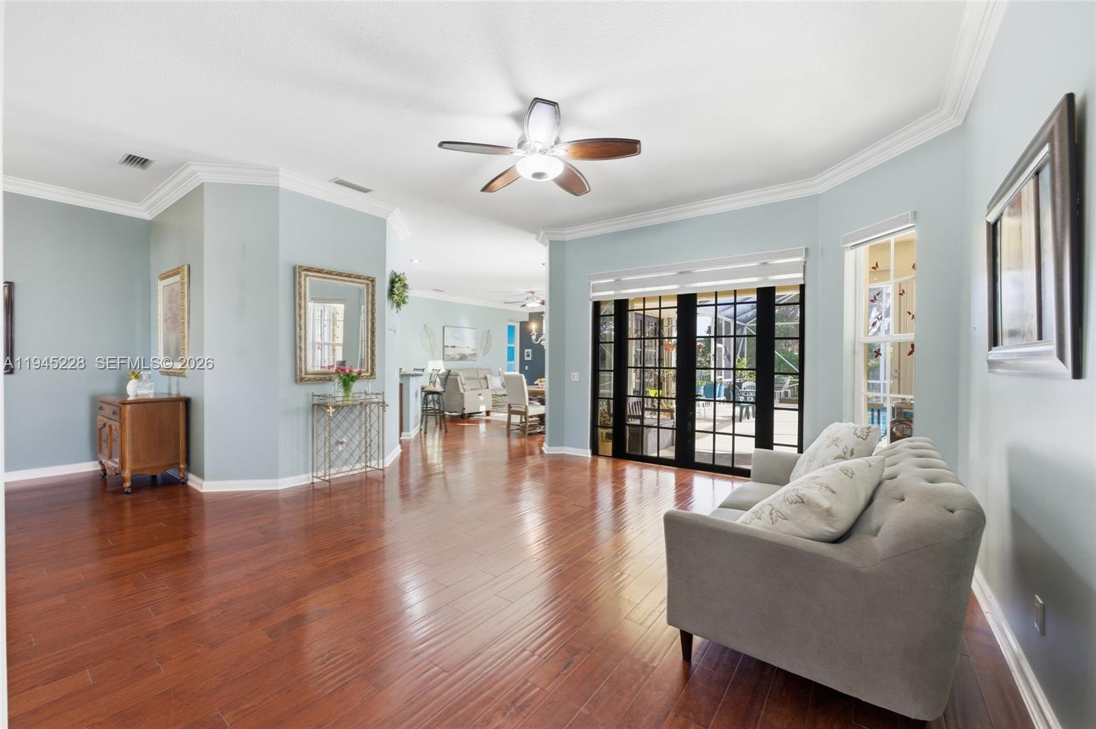 7646 Red River Road West Palm Beach, FL 33411 - Photo 9 of 69 a living room with furniture and a large window