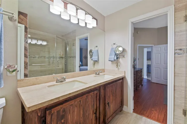a bathroom with a sink double vanity and a mirror