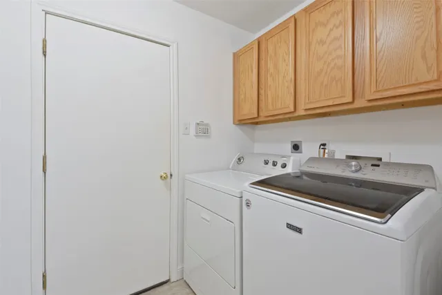 a view white cabinets and sink