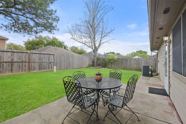 a view of a patio with a yard