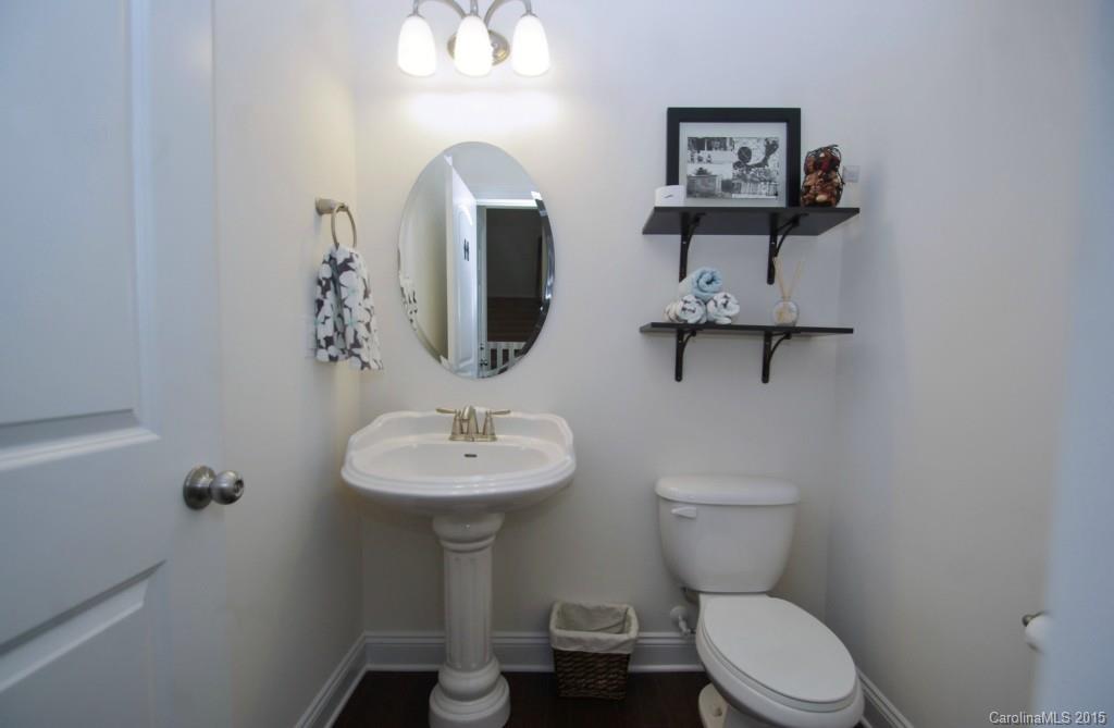 2001 Fallondale Road, Unit 919 Waxhaw, NC 28173 - Photo 10 of 24 a bathroom with a toilet sink and mirror
