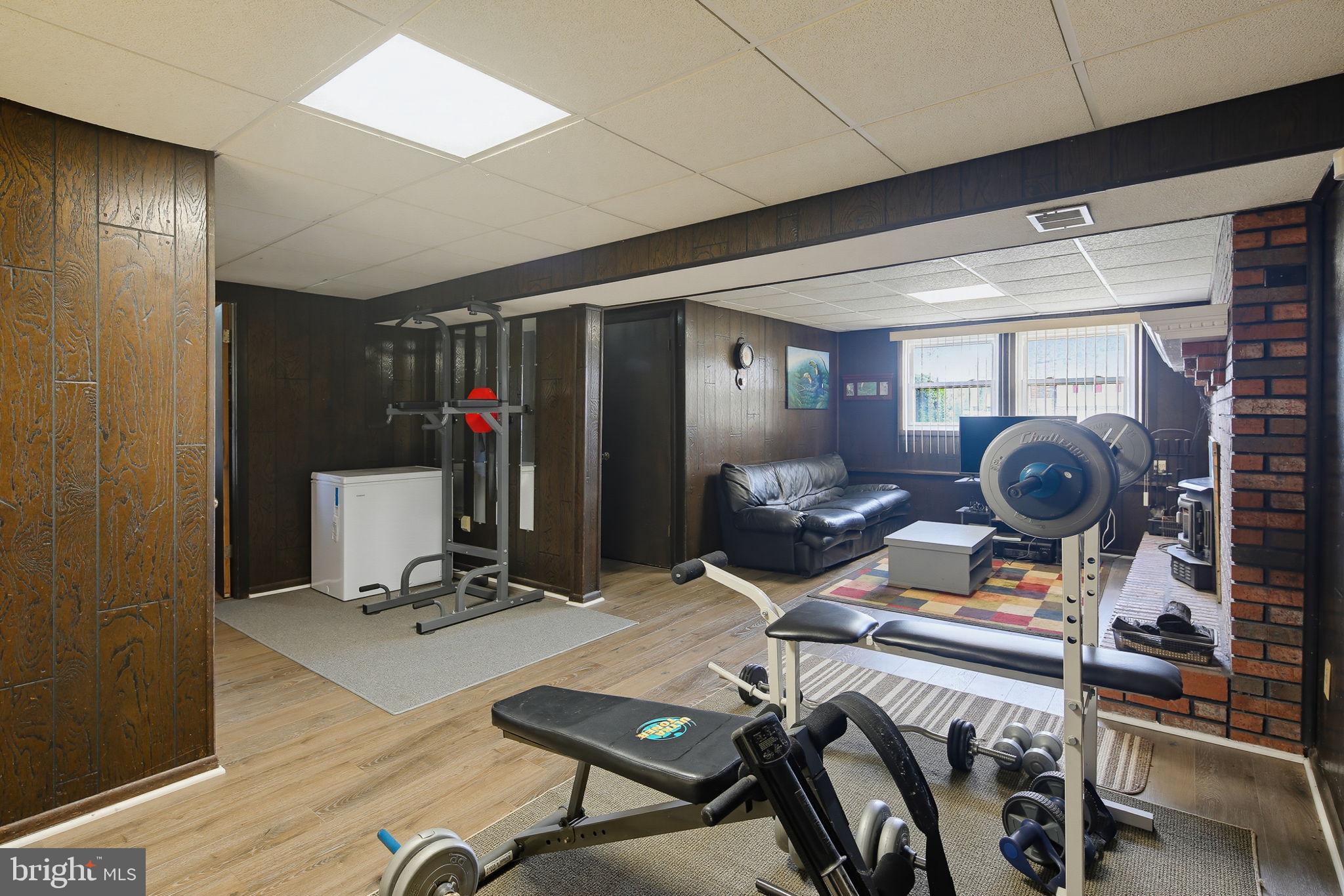 7802 Bastille Road Severn, MD 21144 - Photo 23 of 34 Versatile basement gym retreat.