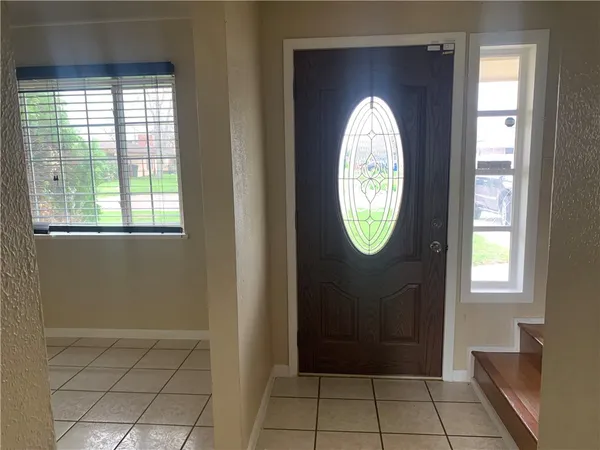 a view of entryway with wooden floor and window