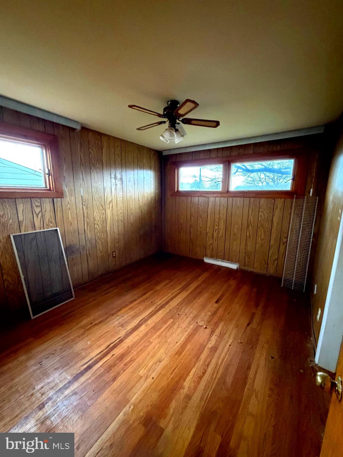 9610 Dedaker Street Philadelphia, PA 19115 - Photo 11 of 22 a view of a room with wooden floor and windows