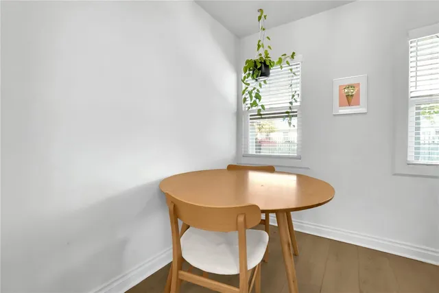 a dining room with a table and chairs
