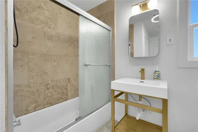 a bathroom with a sink and a mirror