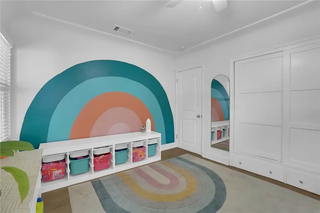 a room with painting and a table