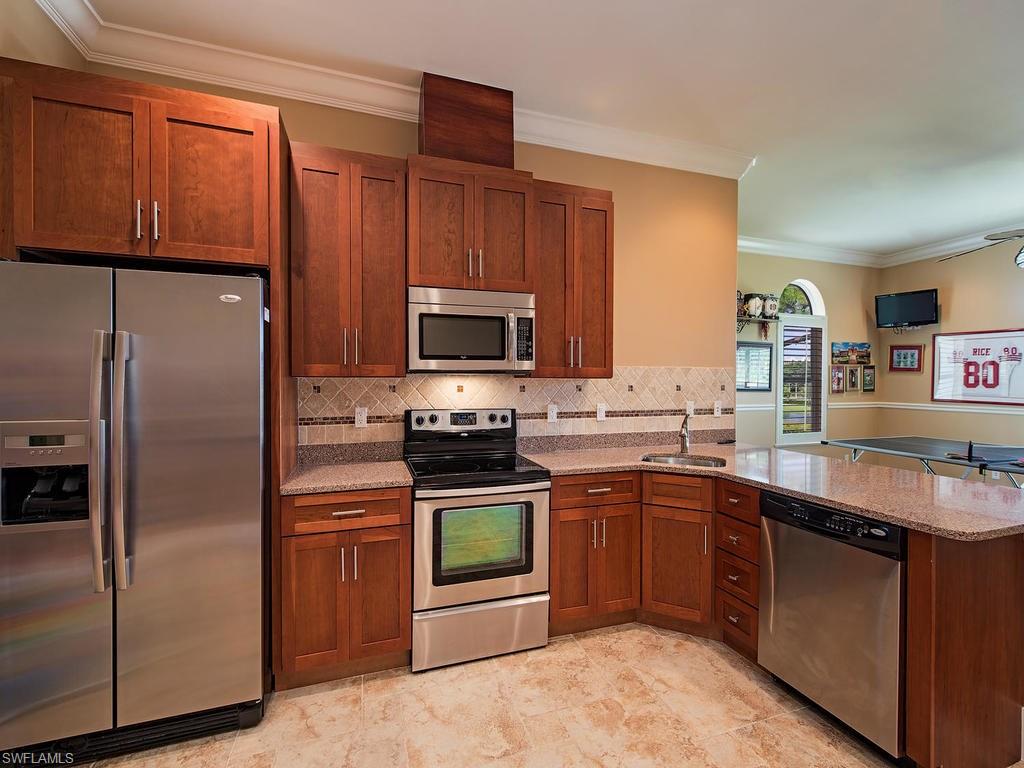 59 Myrtle Road Naples, FL 34108 - Photo 14 of 25 2nd floor full kitchen and game room also includes secondary laundry