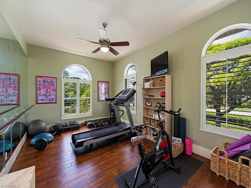 59 Myrtle Road Naples, FL 34108 - Photo 16 of 25 Fitness room with ballet bar and mirrors could be a 6th bedroom (has closet)