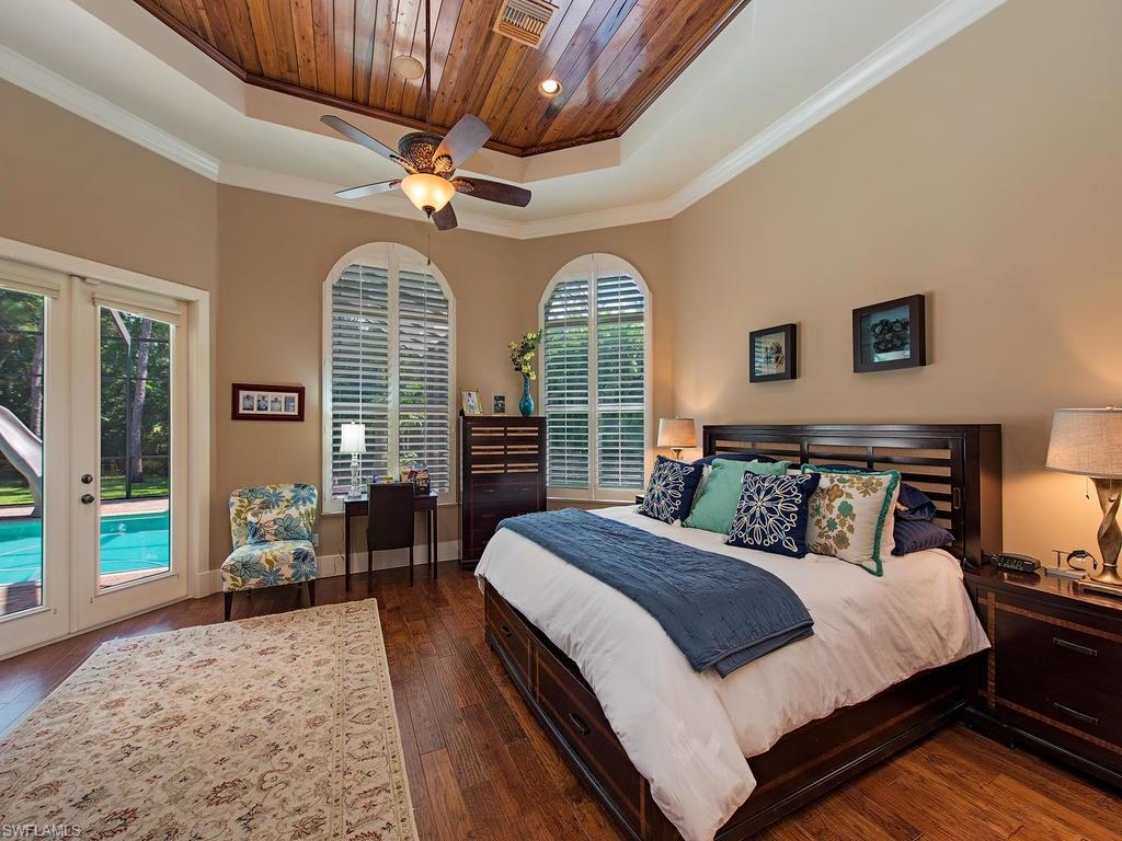 59 Myrtle Road Naples, FL 34108 - Photo 9 of 25 Master bedroom with direct access to pool and spa