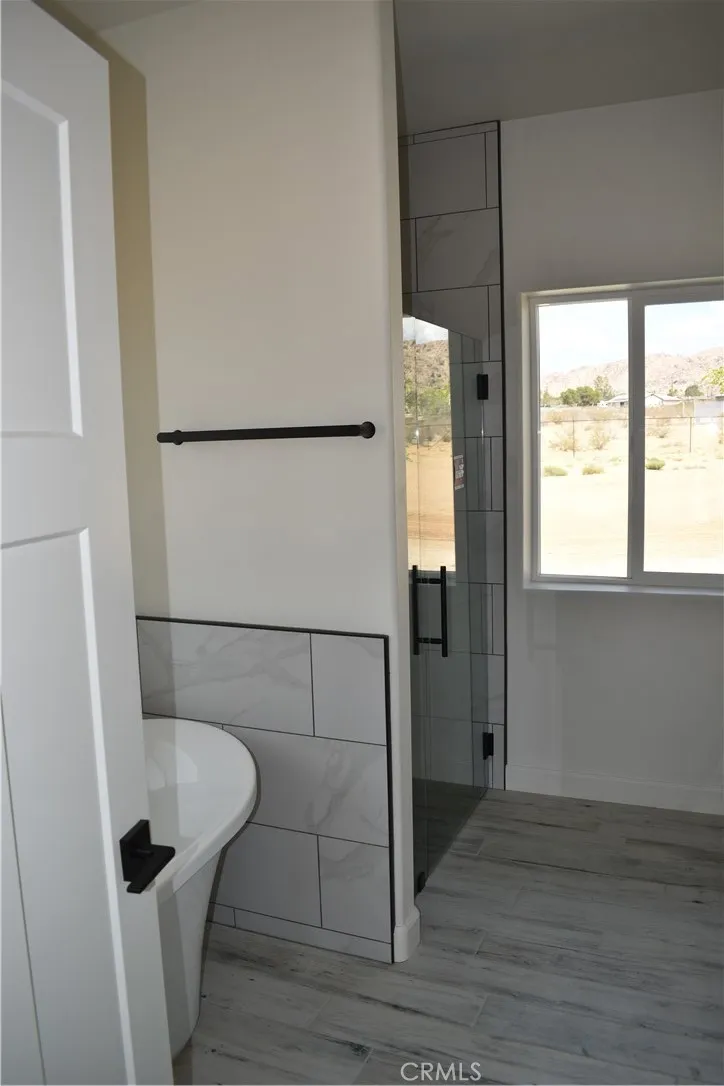 16944 Pauhaska Road Apple Valley, CA 92308 - Photo 18 of 74 a bathroom with a sink and a shower