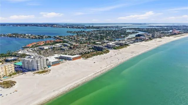 a kitchen with stainless steel appliances granite countertop a stove and cabinets
