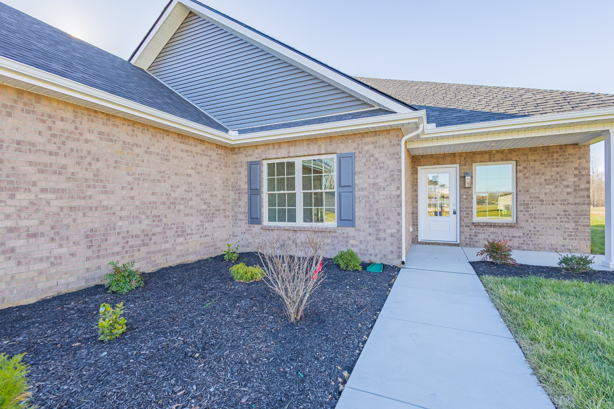 58 Brooklyn Avenue Manchester, TN 37355 - Photo 16 of 62 a front view of a house with garden
