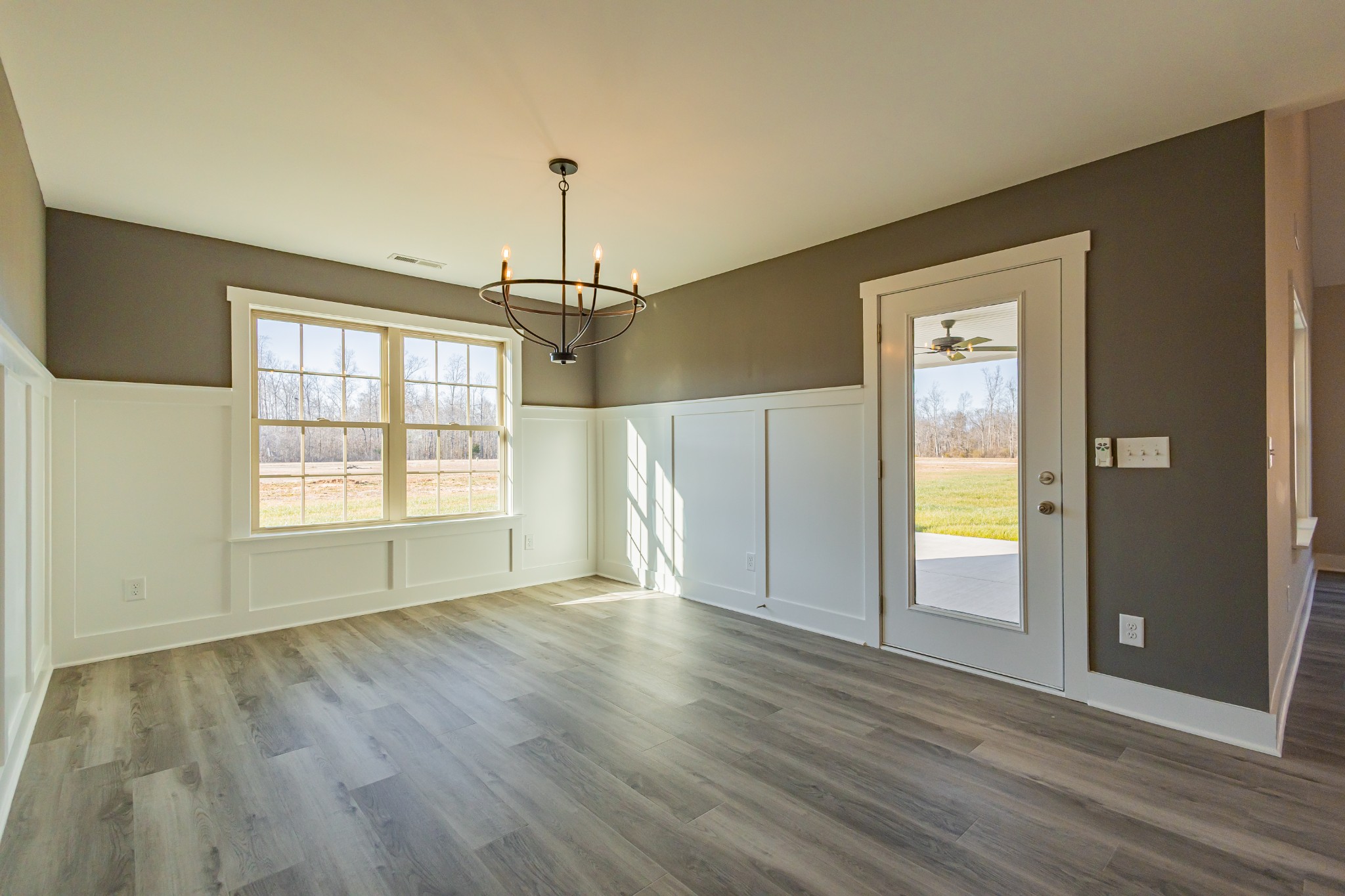 58 Brooklyn Avenue Manchester, TN 37355 - Photo 34 of 62 a view of an empty room with a window and wooden floor