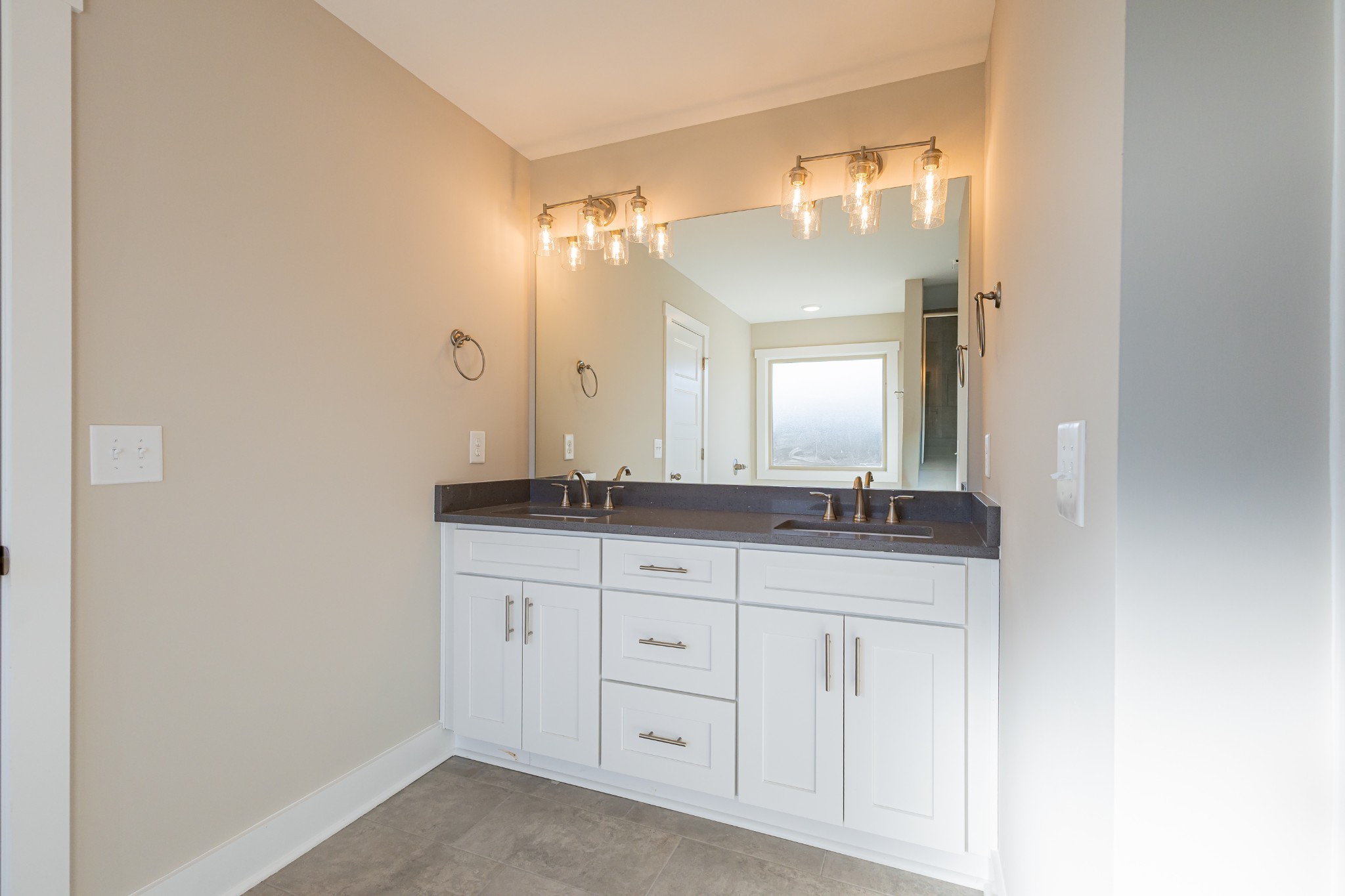 58 Brooklyn Avenue Manchester, TN 37355 - Photo 37 of 62 a bathroom with a granite countertop sink and a mirror