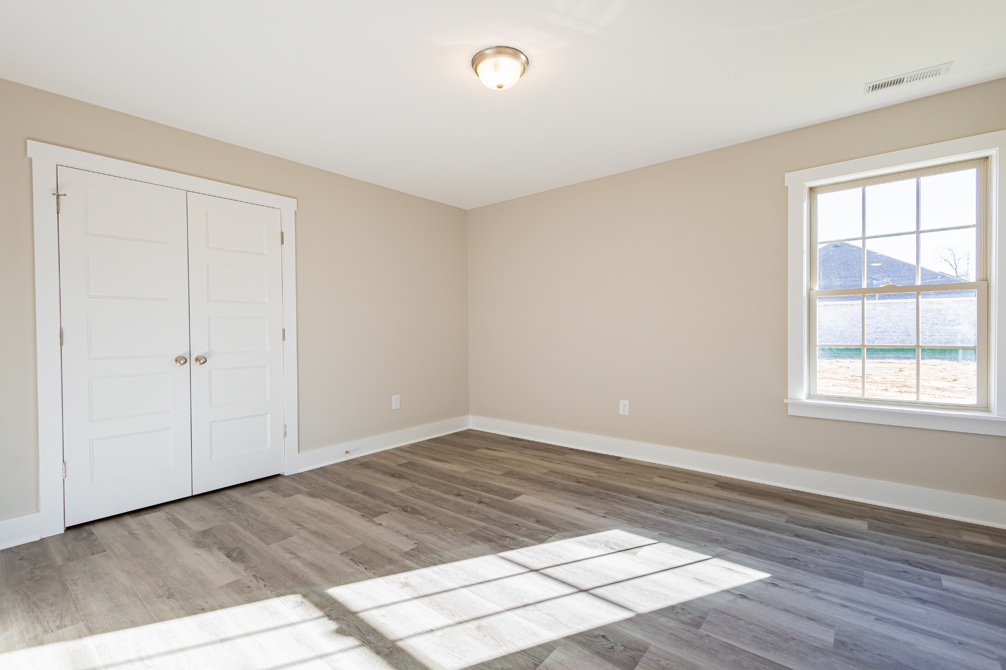 58 Brooklyn Avenue Manchester, TN 37355 - Photo 44 of 62 a view of empty room with wooden floor and fan