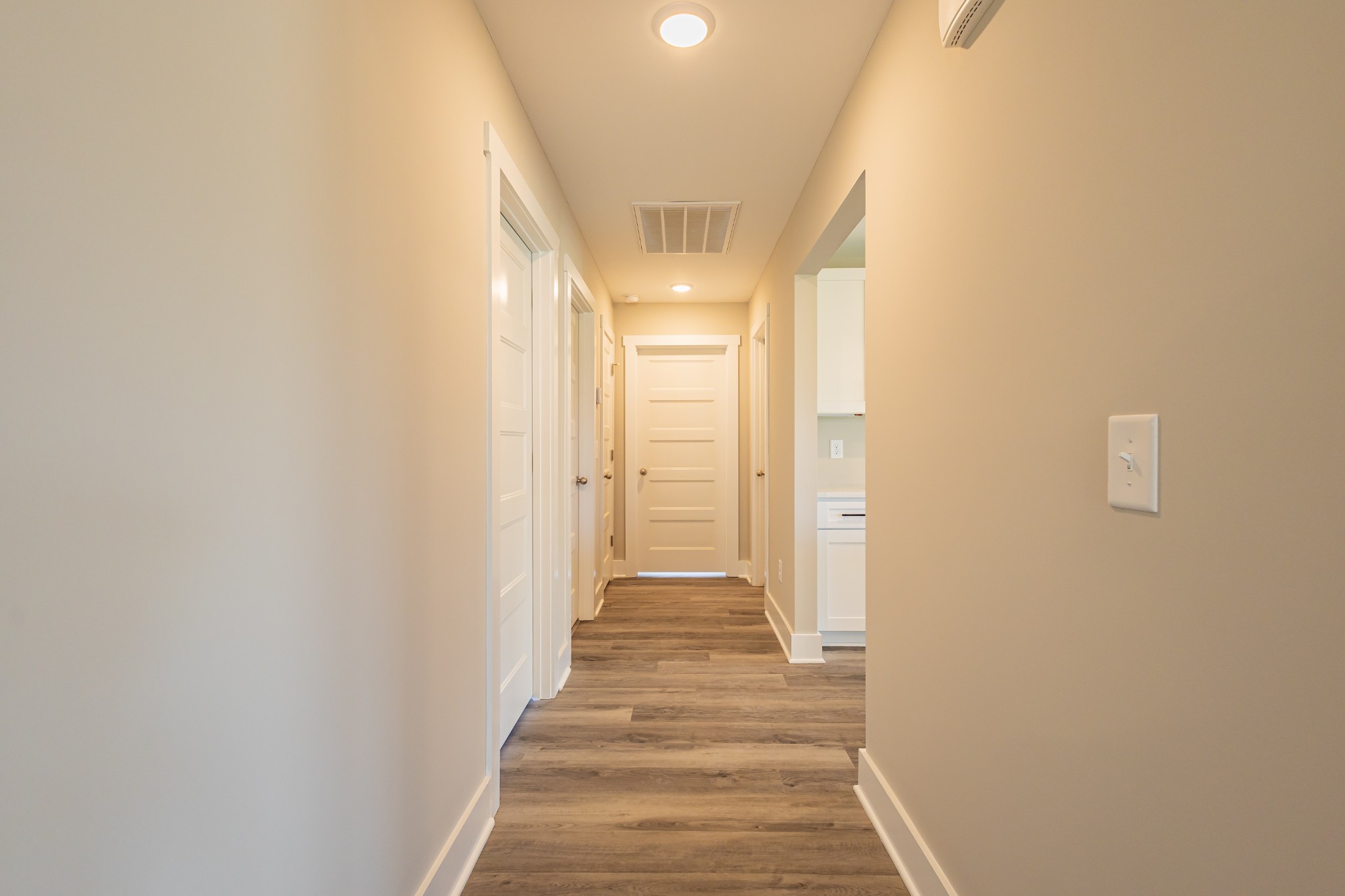 58 Brooklyn Avenue Manchester, TN 37355 - Photo 57 of 62 a view of a hallway with wooden floor and staircase