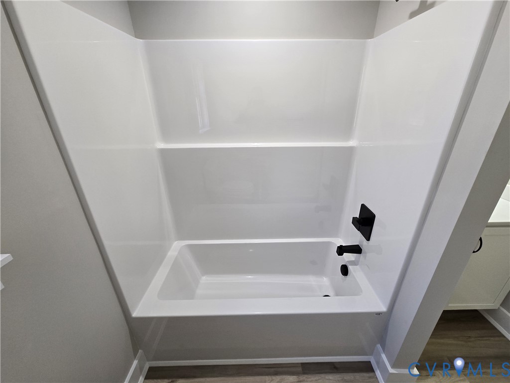 1781 Bumpass Road Bumpass, VA 23024 - Photo 25 of 26 a bathroom with a bathtub