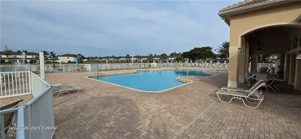 a view of a swimming pool and deck