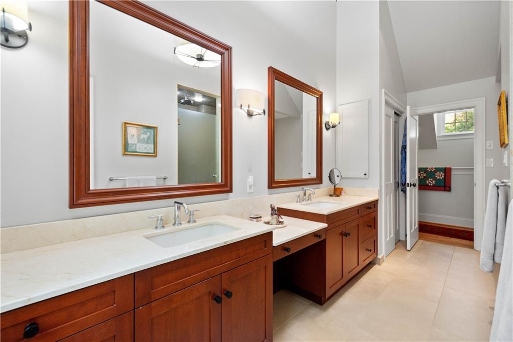 739 Chestnut Road Sewickley, PA 15143 - Photo 26 of 45 Primary bath has double vanities, tub, large tiled shower and toilet room.