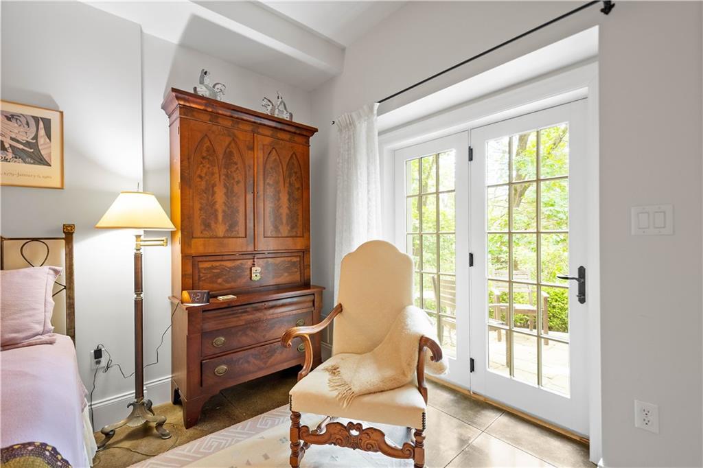 739 Chestnut Road Sewickley, PA 15143 - Photo 34 of 45 French doors to a secret stone terrace that would be perfect for morning coffee in the woods.