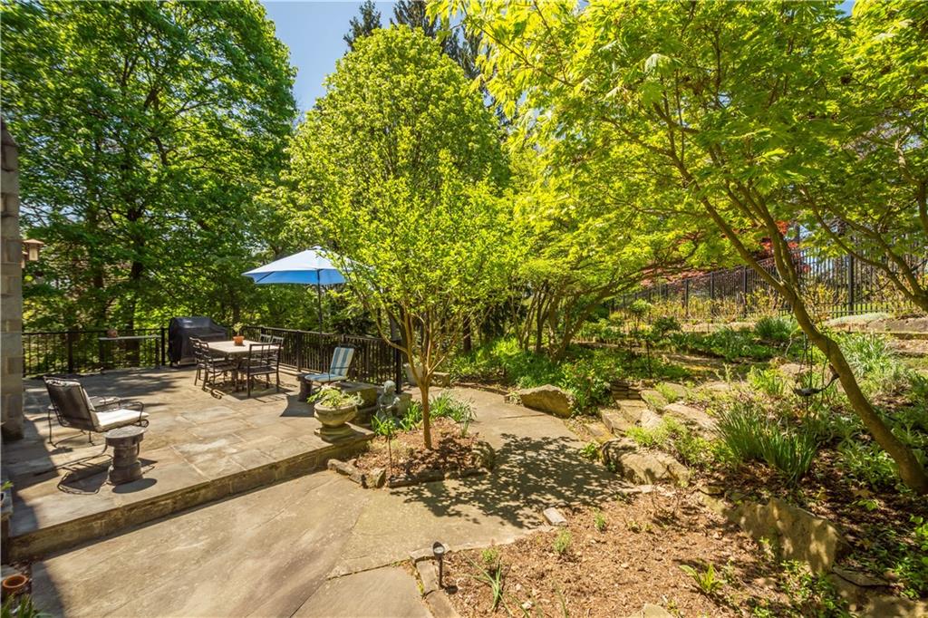 739 Chestnut Road Sewickley, PA 15143 - Photo 38 of 45 The stone terrace off the living room leads to paths planted with perennials and ferns.