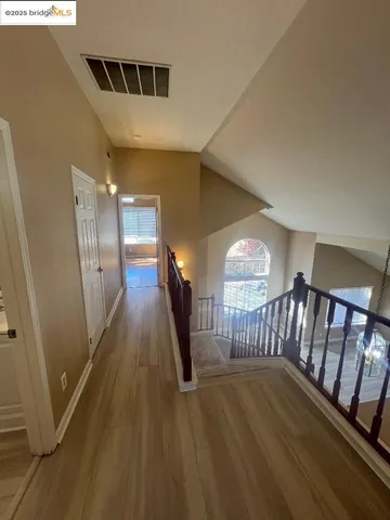 a view of entryway with wooden floor