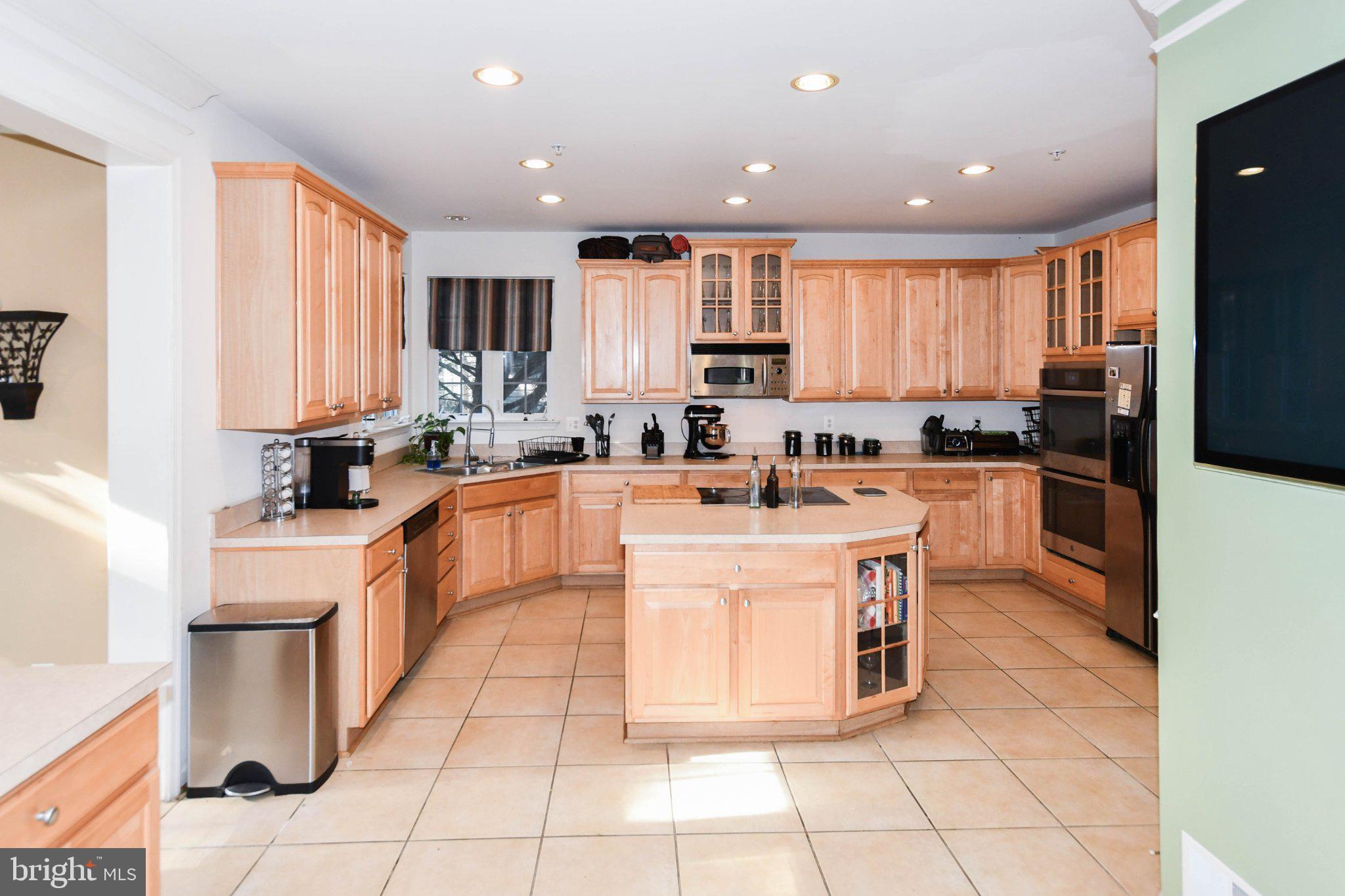 3208 Clavier Place Clinton, MD 20735 - Photo 19 of 55 Spacious kitchen with warm wood tones.