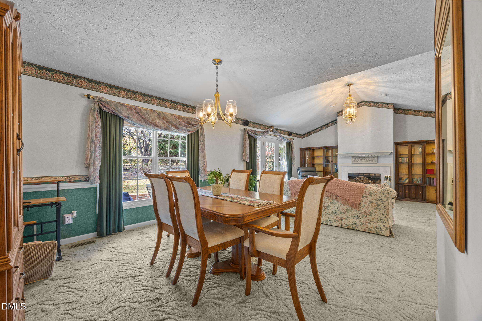 69 Deer Run Court Angier, NC 27501 - Photo 9 of 40 a dining room with furniture a chandelier and window