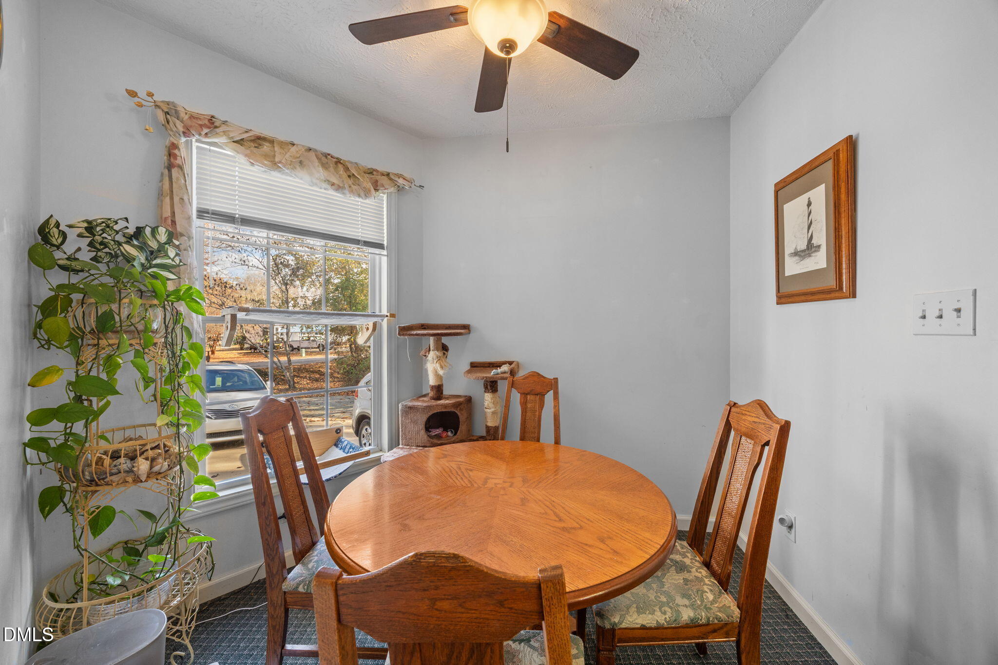 69 Deer Run Court Angier, NC 27501 - Photo 12 of 40 a view of a dining room with furniture and a window