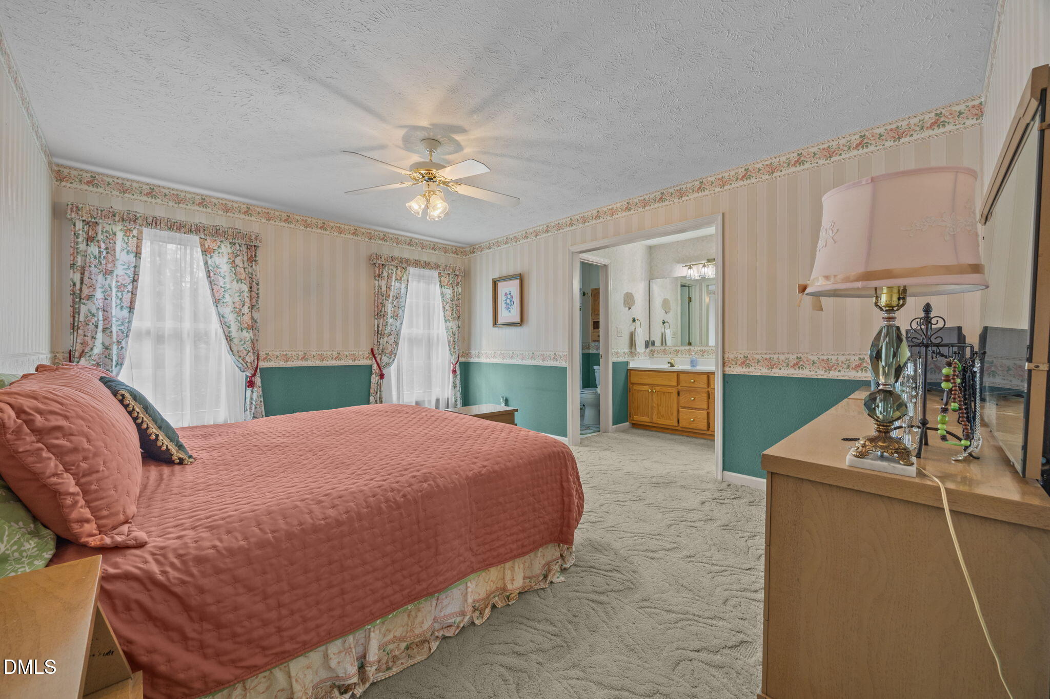 69 Deer Run Court Angier, NC 27501 - Photo 13 of 40 a bed room with a bed window and a couch