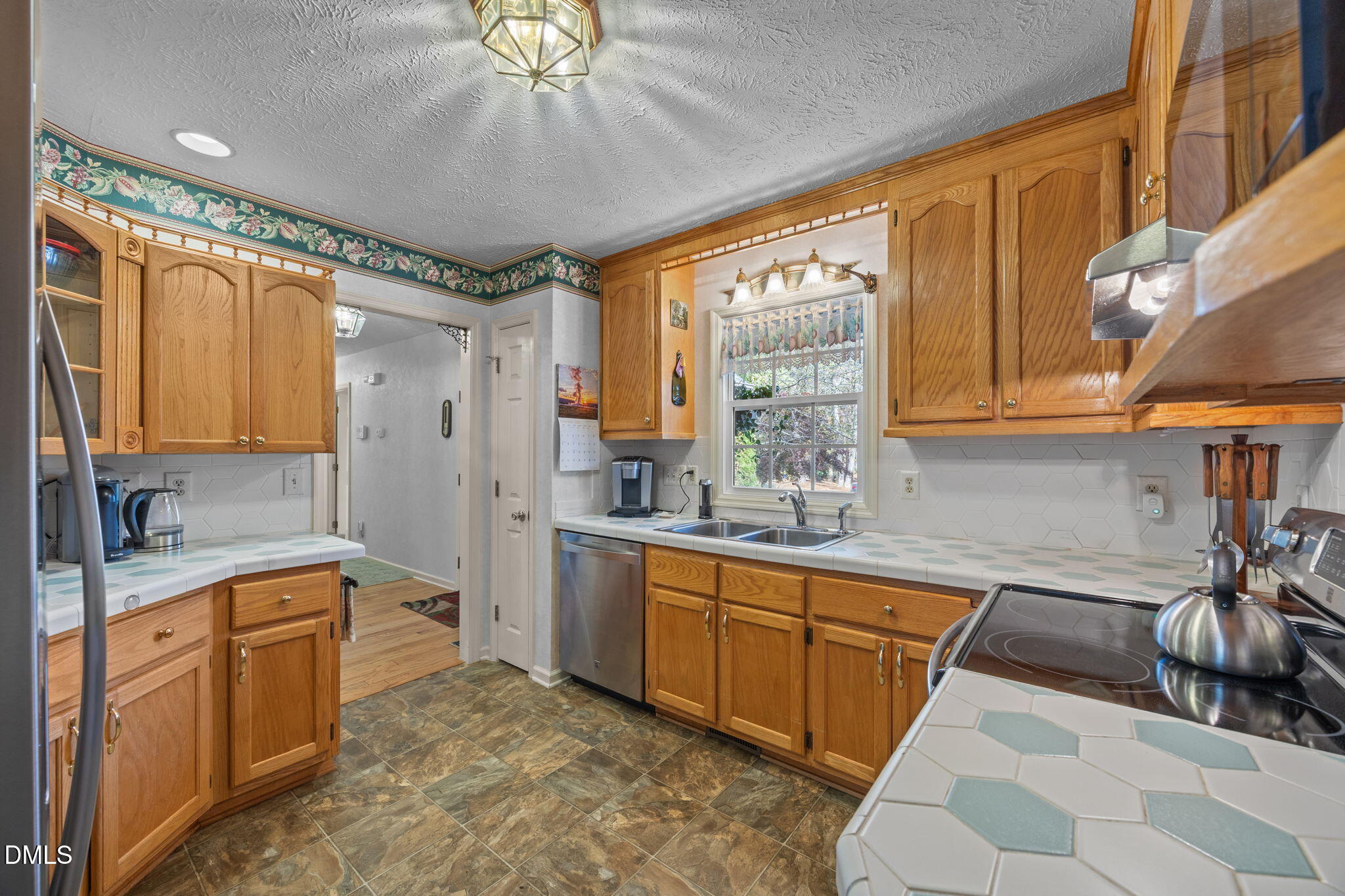 69 Deer Run Court Angier, NC 27501 - Photo 17 of 40 a bathroom with a sink a large mirror and a bathtub