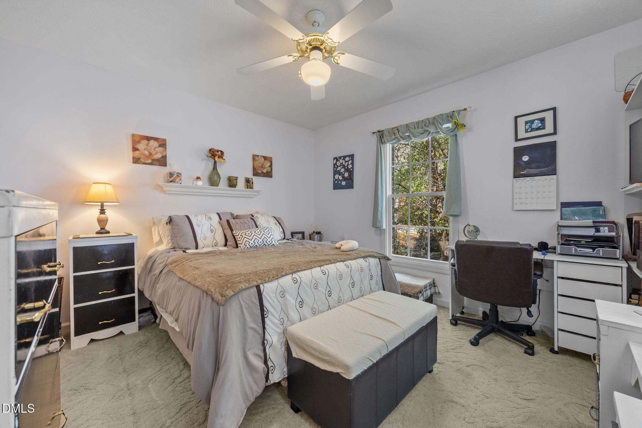 69 Deer Run Court Angier, NC 27501 - Photo 20 of 40 a bedroom with a bed a couch and a window