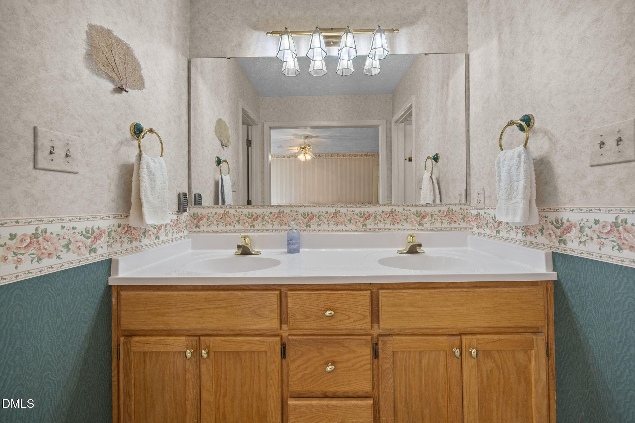 69 Deer Run Court Angier, NC 27501 - Photo 22 of 40 a bathroom with a sink vanity and a mirror