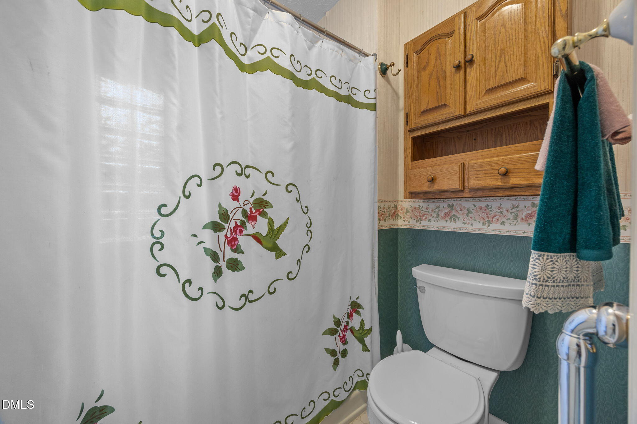 69 Deer Run Court Angier, NC 27501 - Photo 23 of 40 a white toilet sitting next to a white curtain