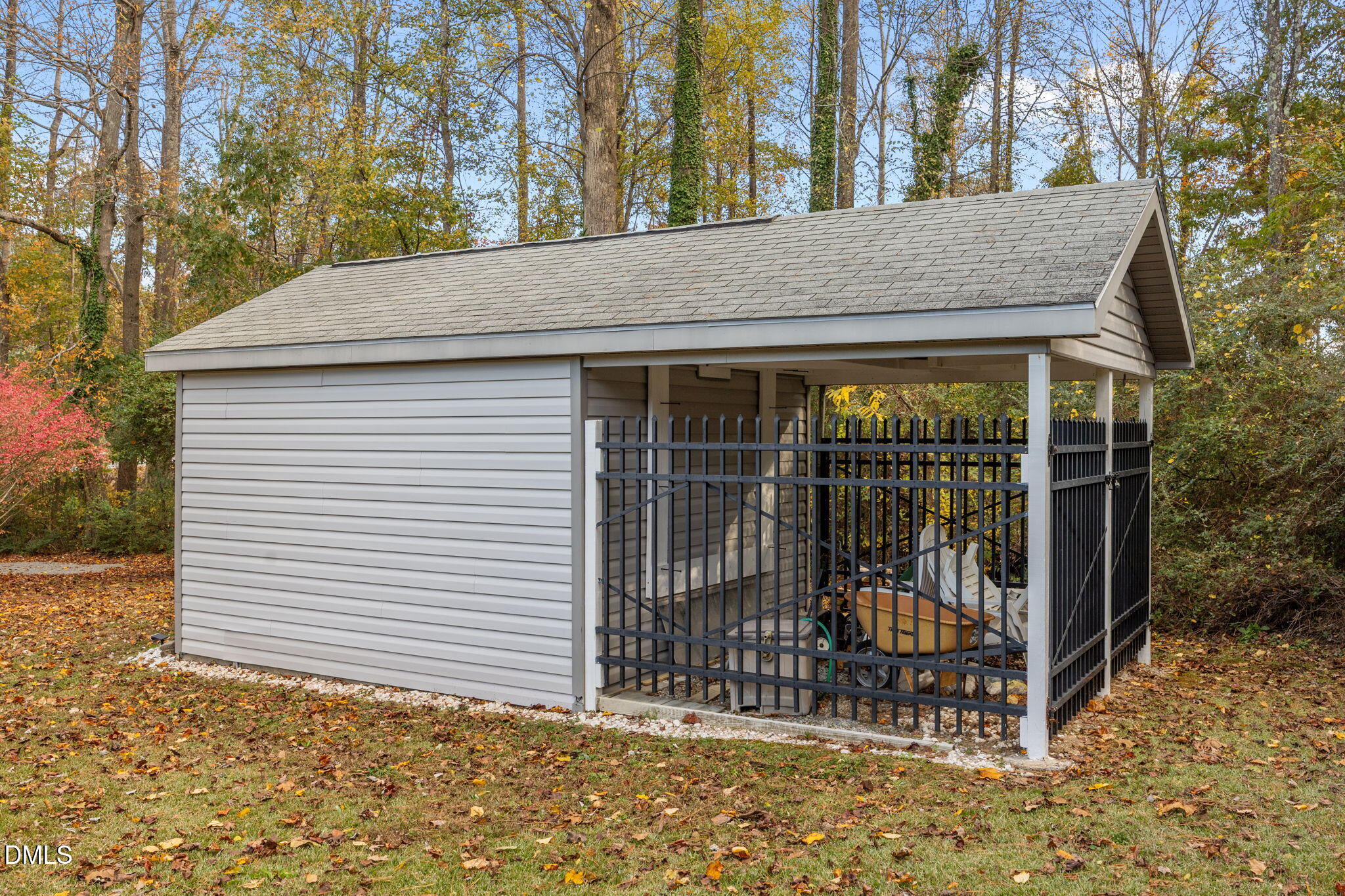 69 Deer Run Court Angier, NC 27501 - Photo 30 of 40 a view of a small house with a small yard and a large tree